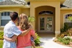 Couple outside house